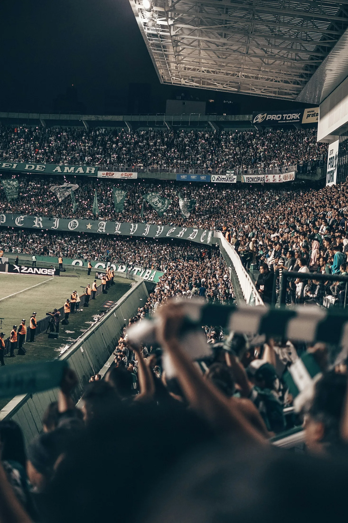 Supporters filling the terraces of a football stadium